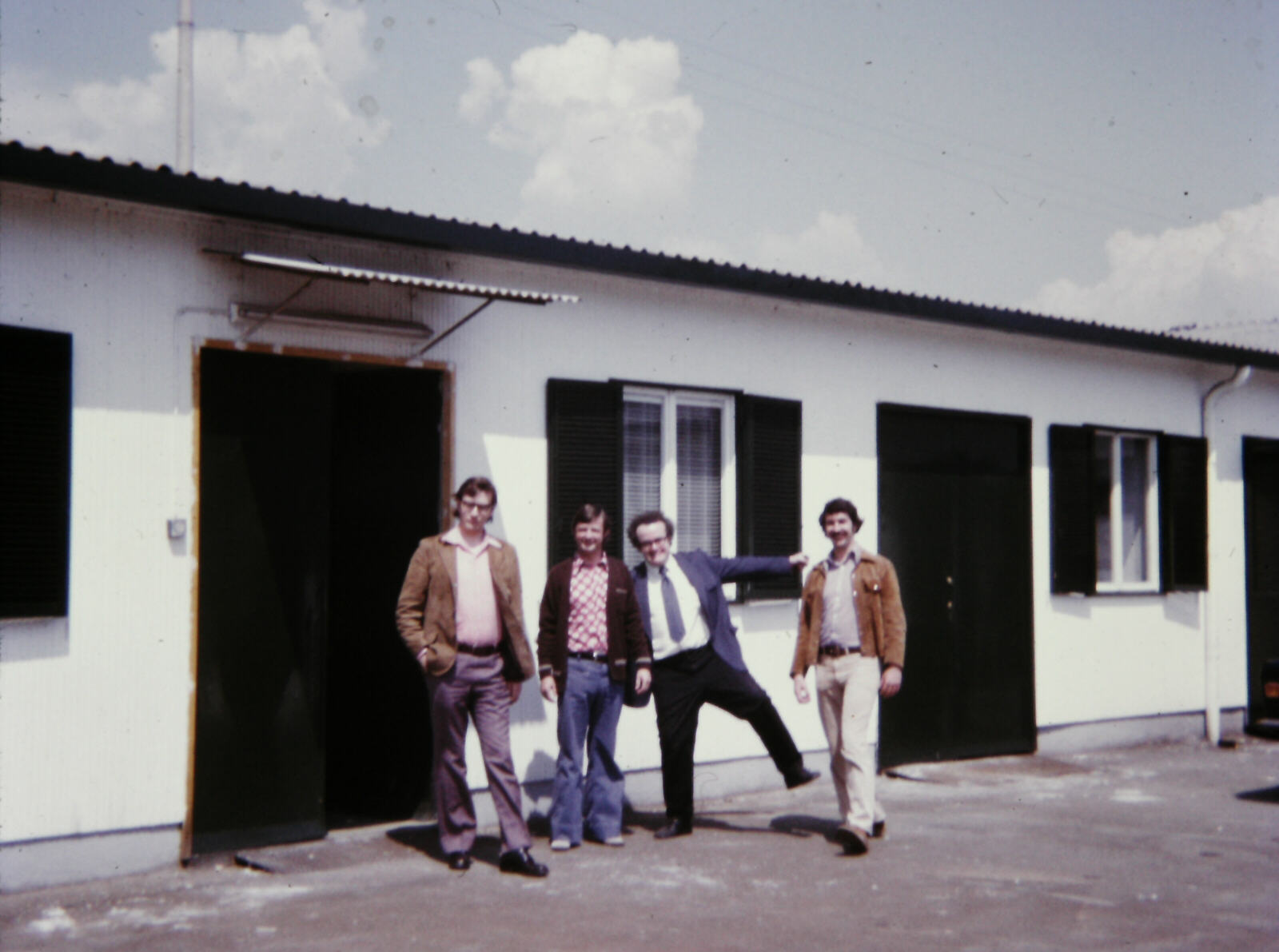 Dave Player, Bob Trigg, John Hennessy and Peter Bailey outside the office at Pregnana, Milan in 1974