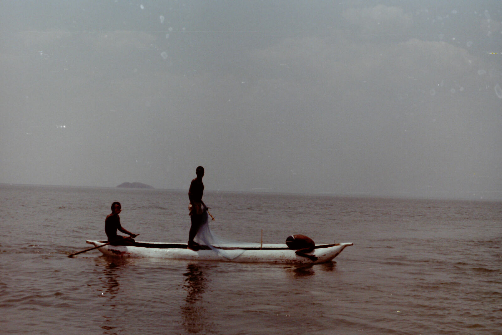 Fishermen in a dugout canoe on Lake Malawi