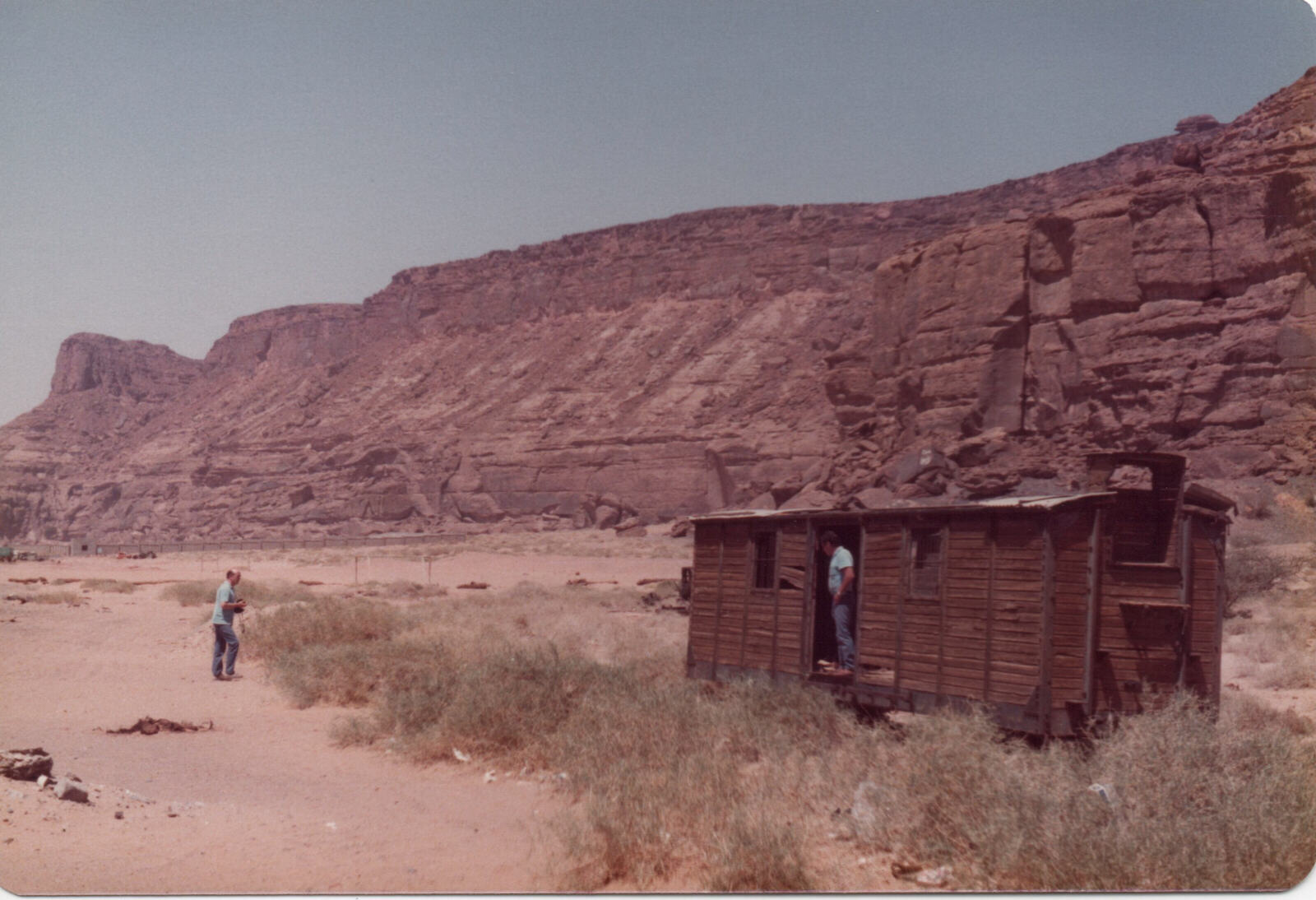 Barry Neil and Peter Holland at the railway waggon at Al Ula station, Saudi Arabia