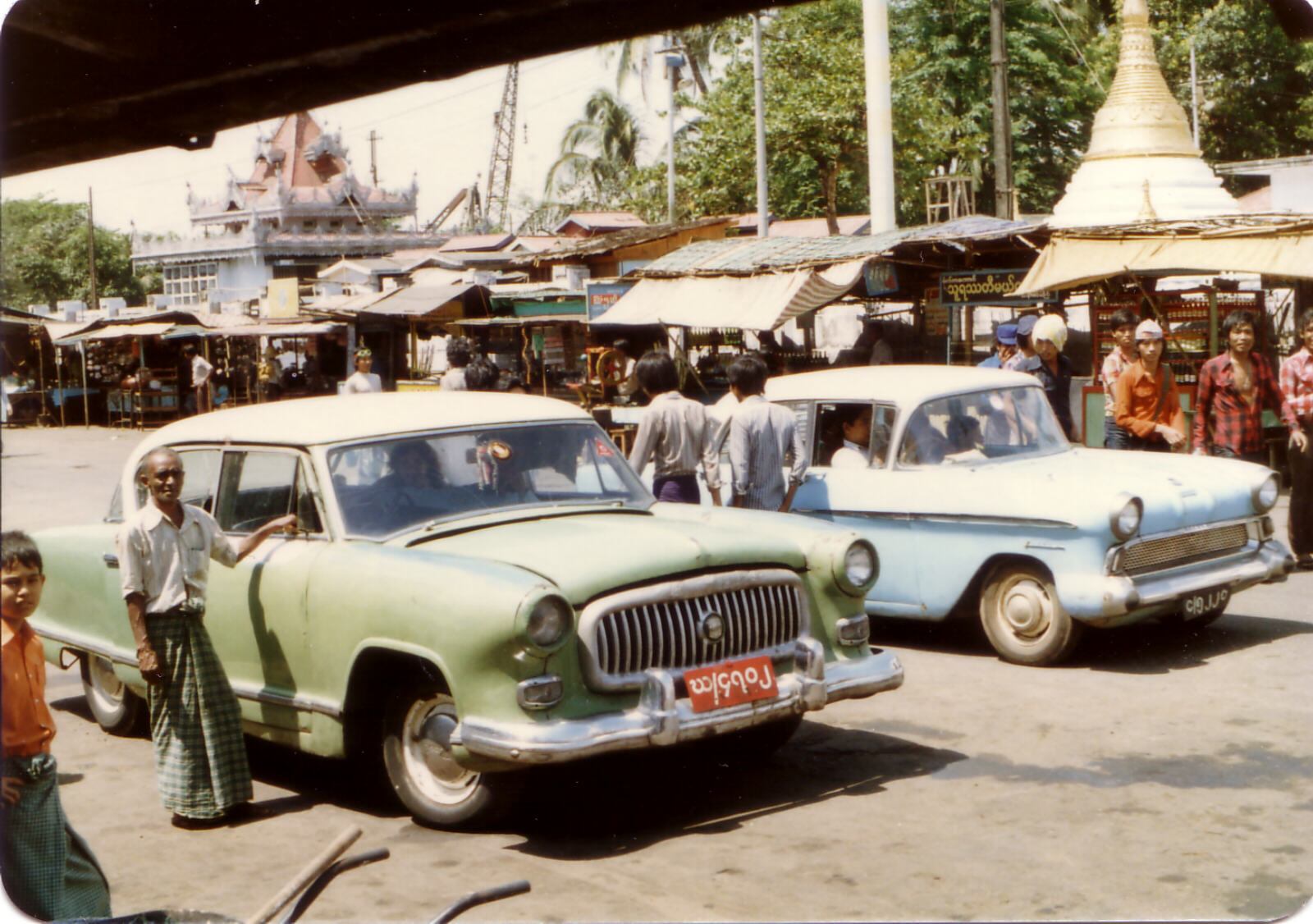 Taxi rank outside the Strand Hotel in Rangoon, Burma