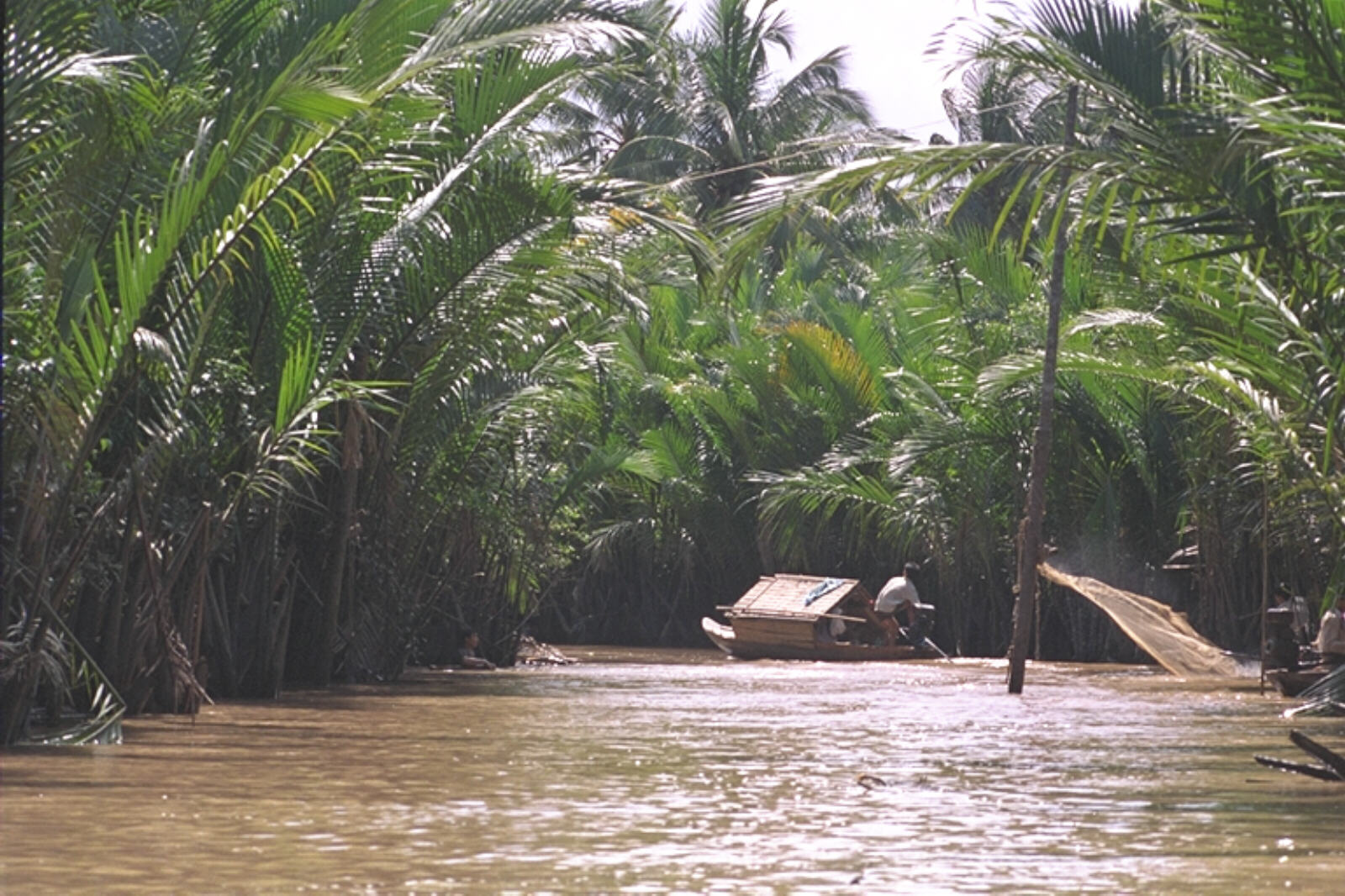 A boat on a creek in the Mekong delta near Mytho, Vietnam