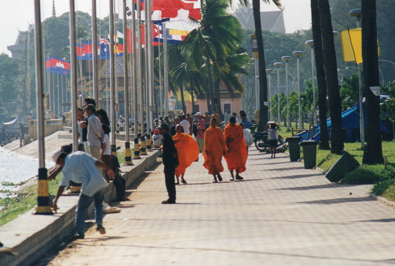 Monks on the riverside walk at Sisowath Quay, Phnom Penh, Cambodia