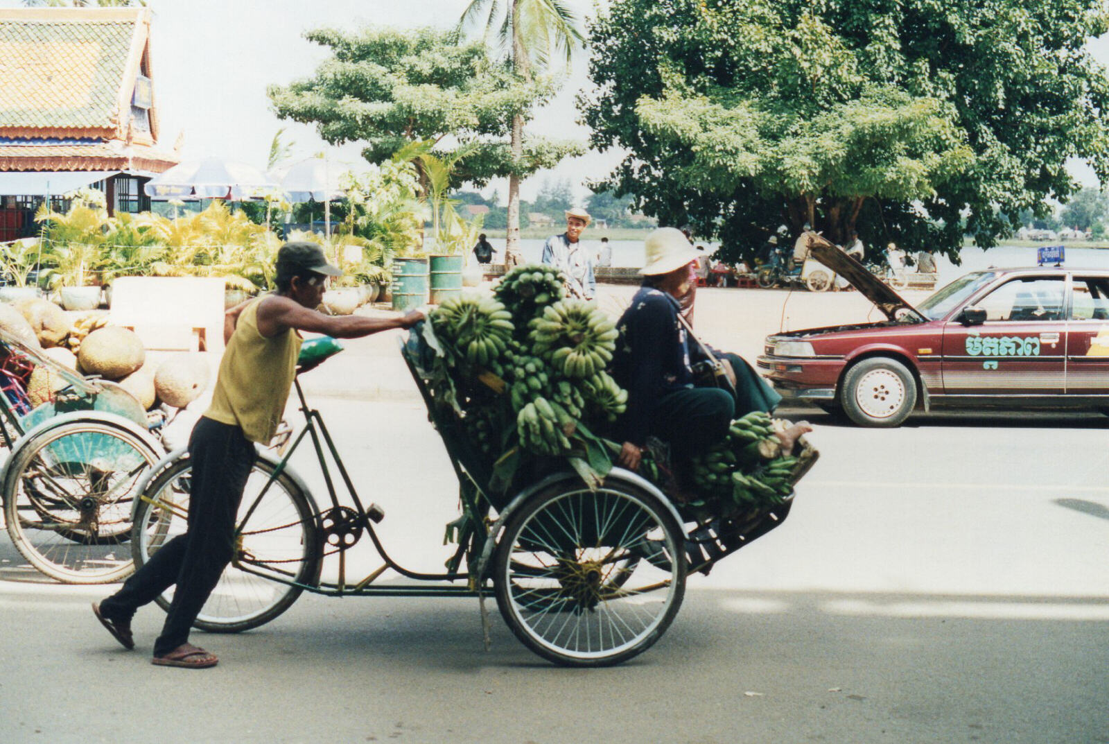 A cyclo with bananas on Sisowath Quay, Phnom Penh, Cambodia