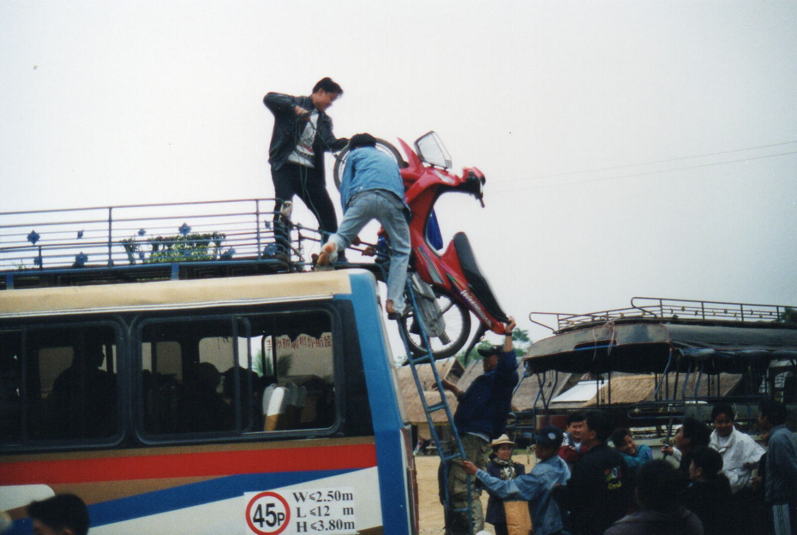 Loading the bus to Vientianne in Luang Phabang, Laos