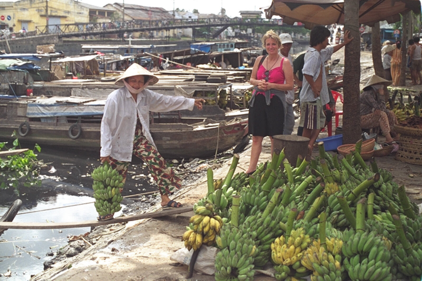 Unloading bananas by the Black River in Cholon, Saigon