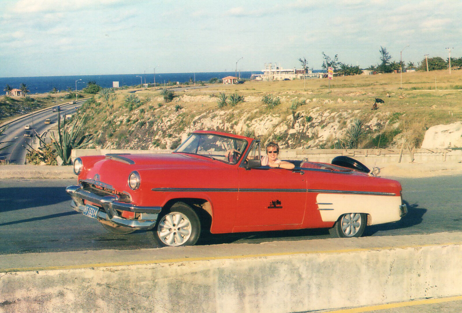 Cruising in a 1954 Mercury car at Castillo de los Tres Reyes, Havana