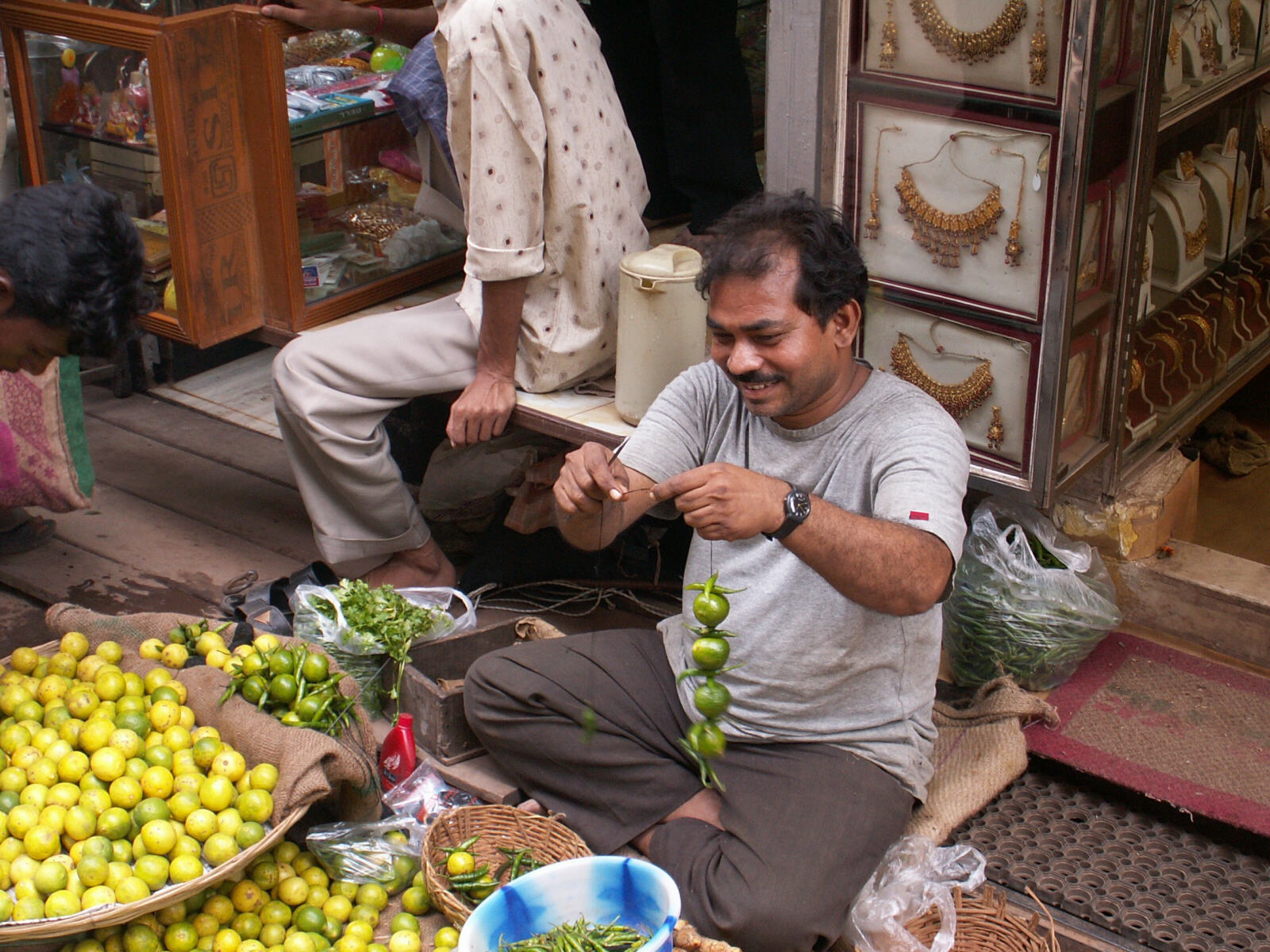 A lemon-and-chilli seller in a street in Calcutta