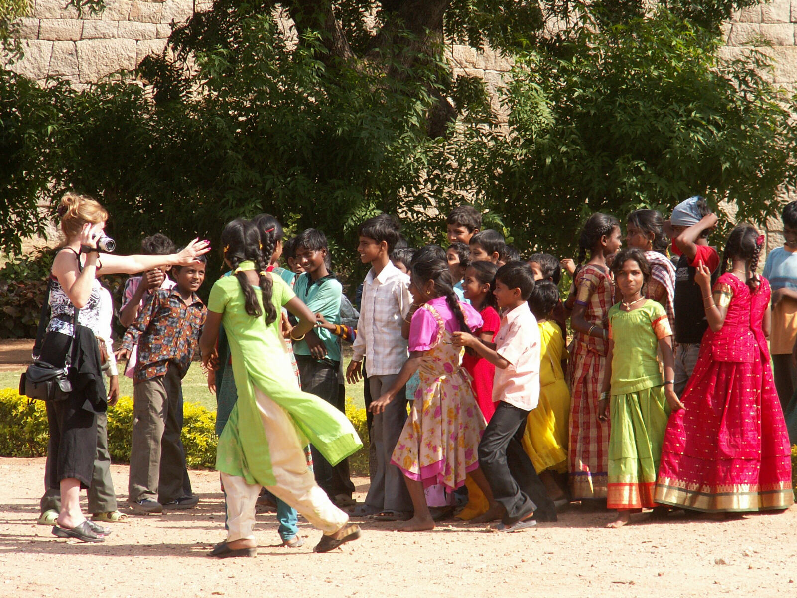 Group photo time in the Zenana enclosure in Hampi, India