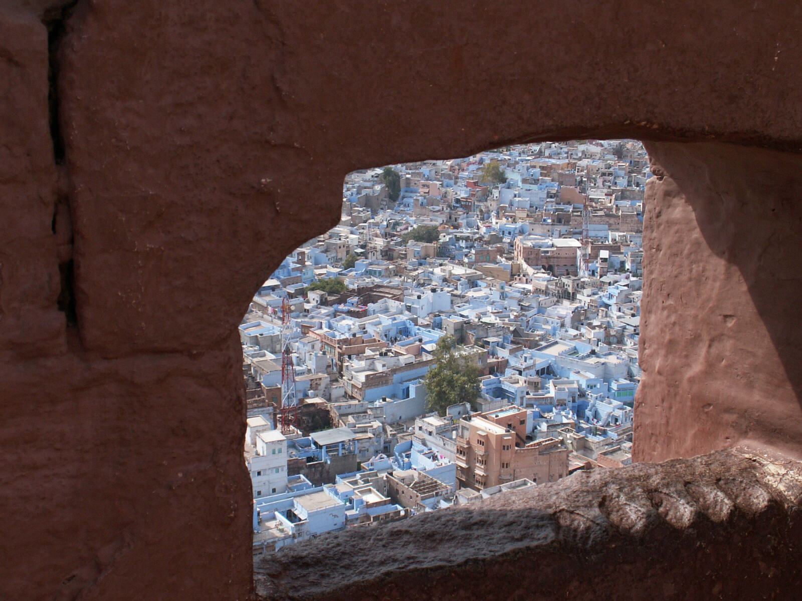 Blue houses of Jodhpur old town through the fort wall