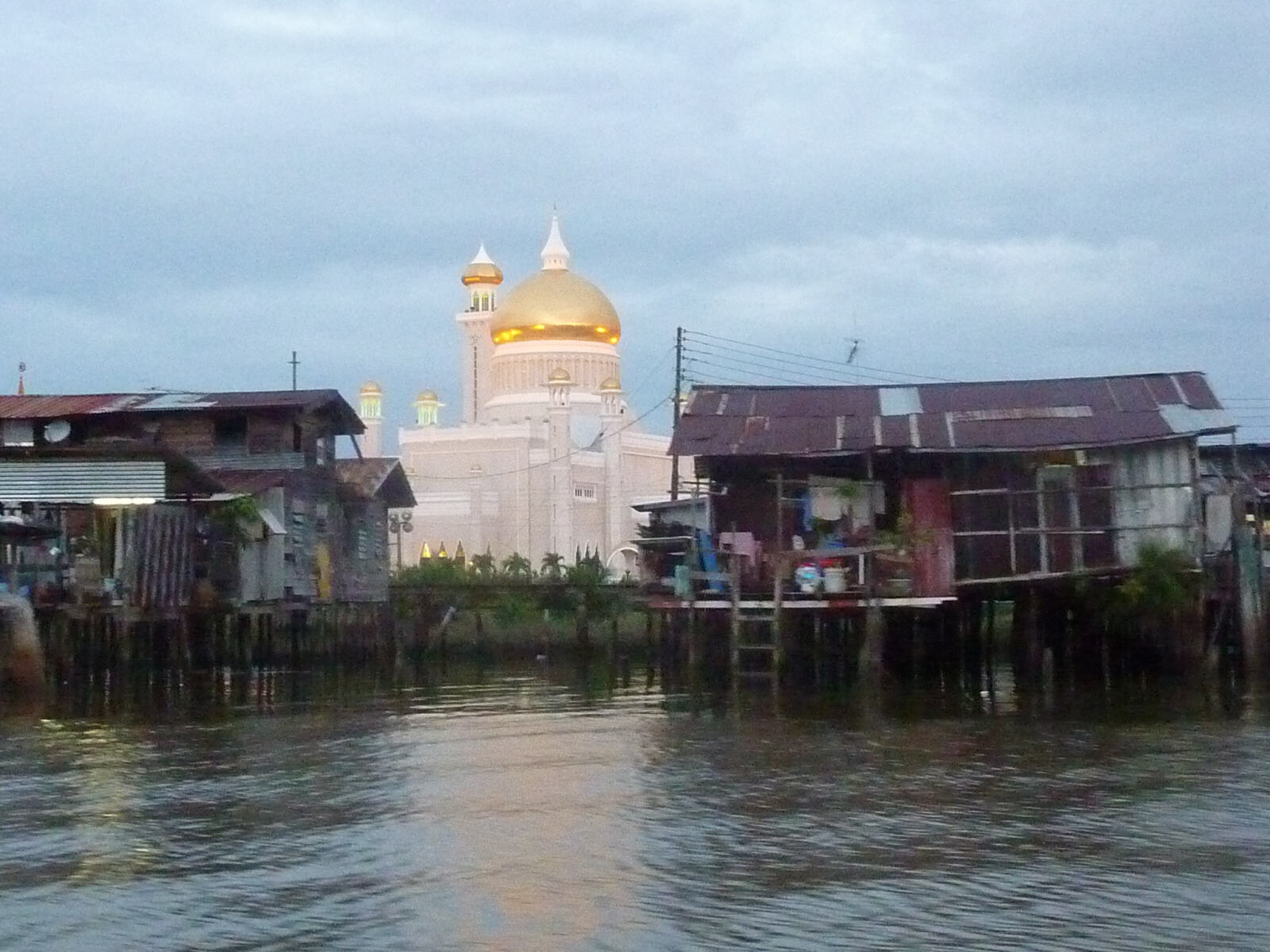 A stilt village and floodlit mosque on the Brunei river