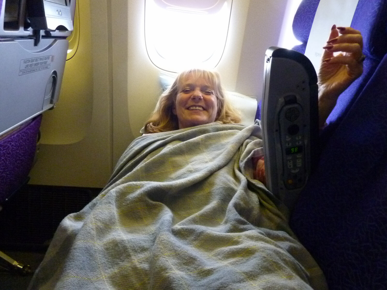 Sheila relaxing on the flight from Brisbane to London