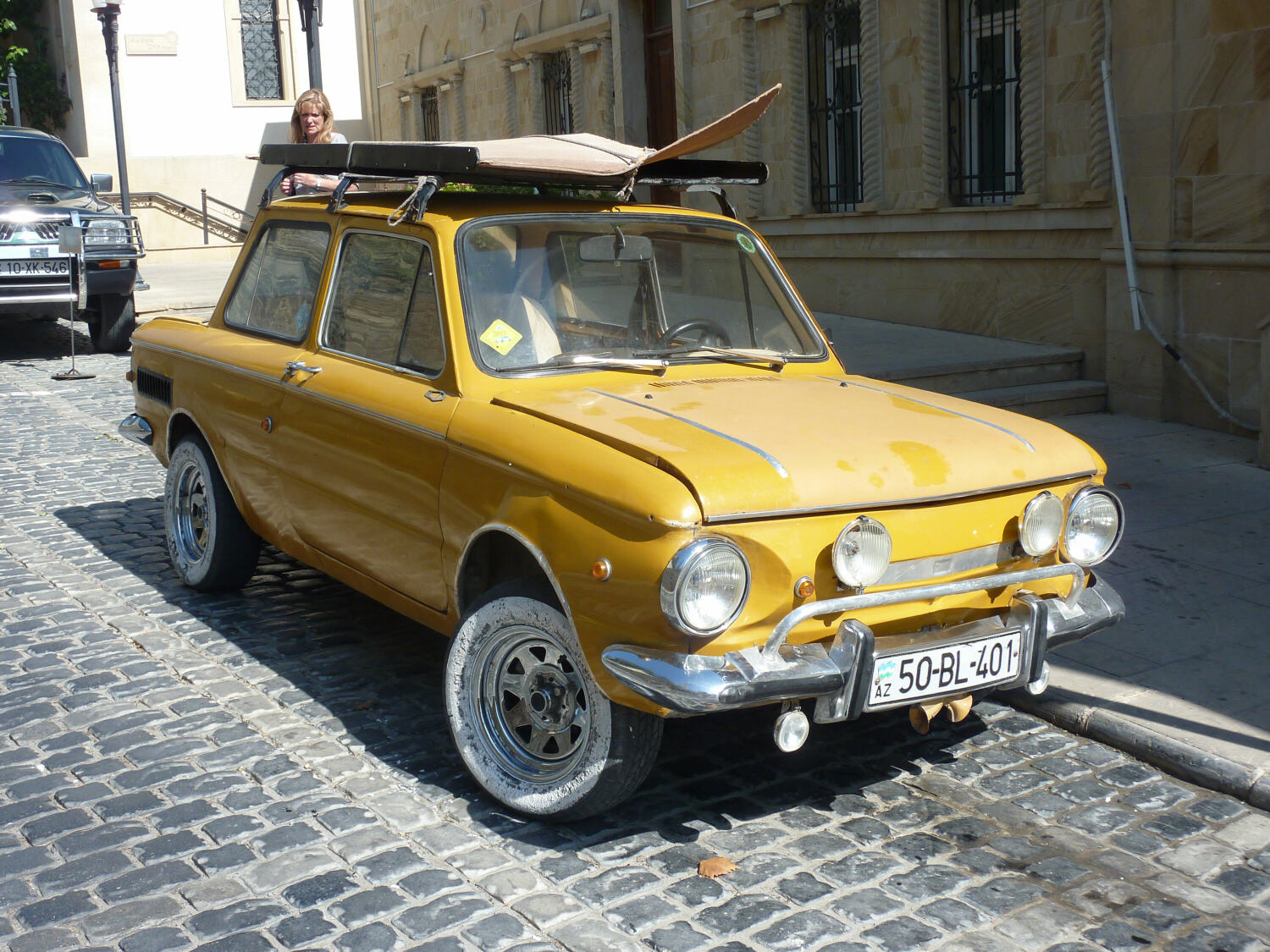 A yellow Soviet-style Lada in Baku, Azerbaijan