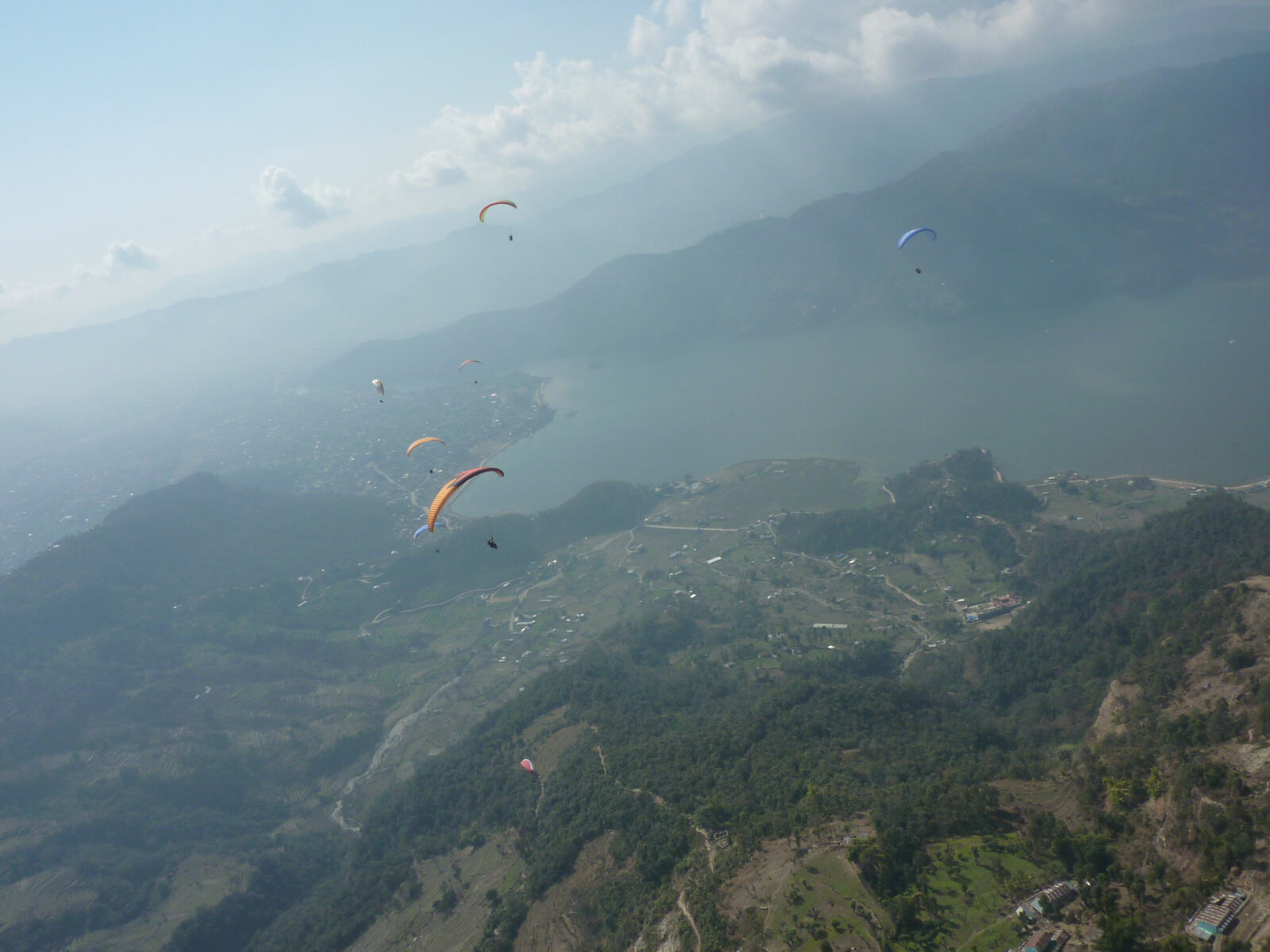 Paragliding over the lake in Pokhara, Nepal