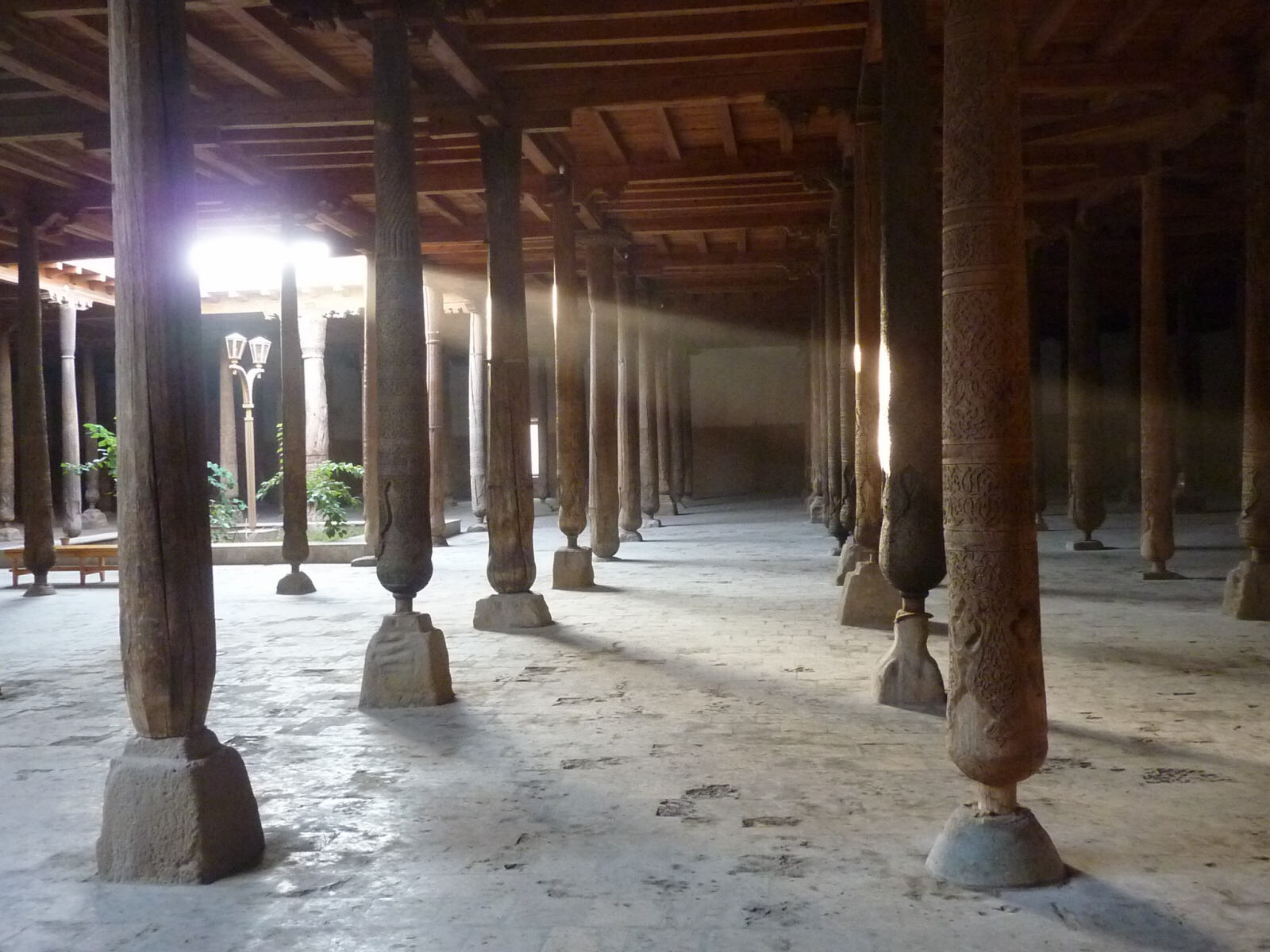 Ancient wooden pillars in the Juma Mosque in Khiva, Uzbekistan