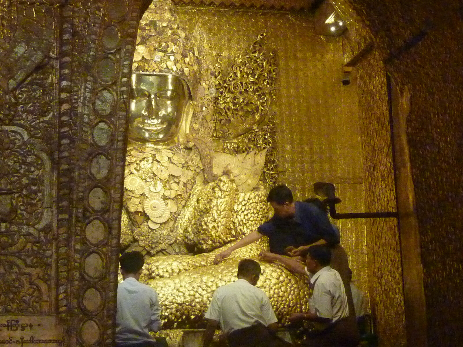 The ancient golden Buddha at Mahamuni Pagoda in Mandalay