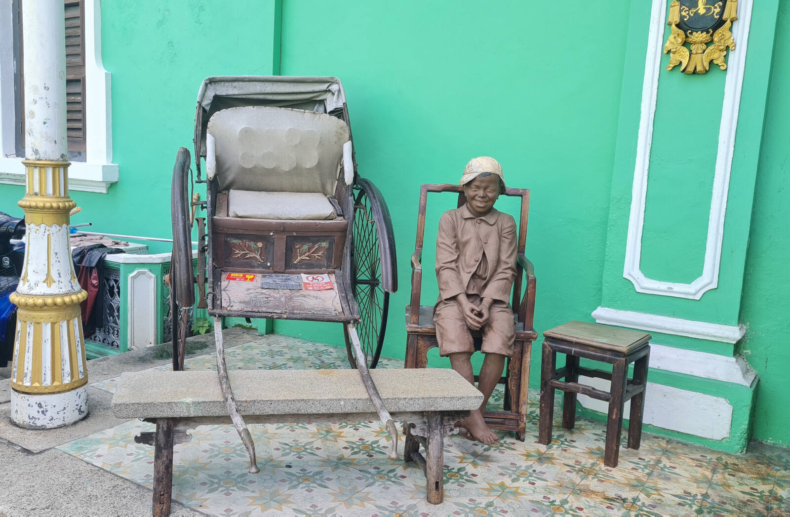 A rickshaw coolie at Peranakan mansion in Georgetown, Penang