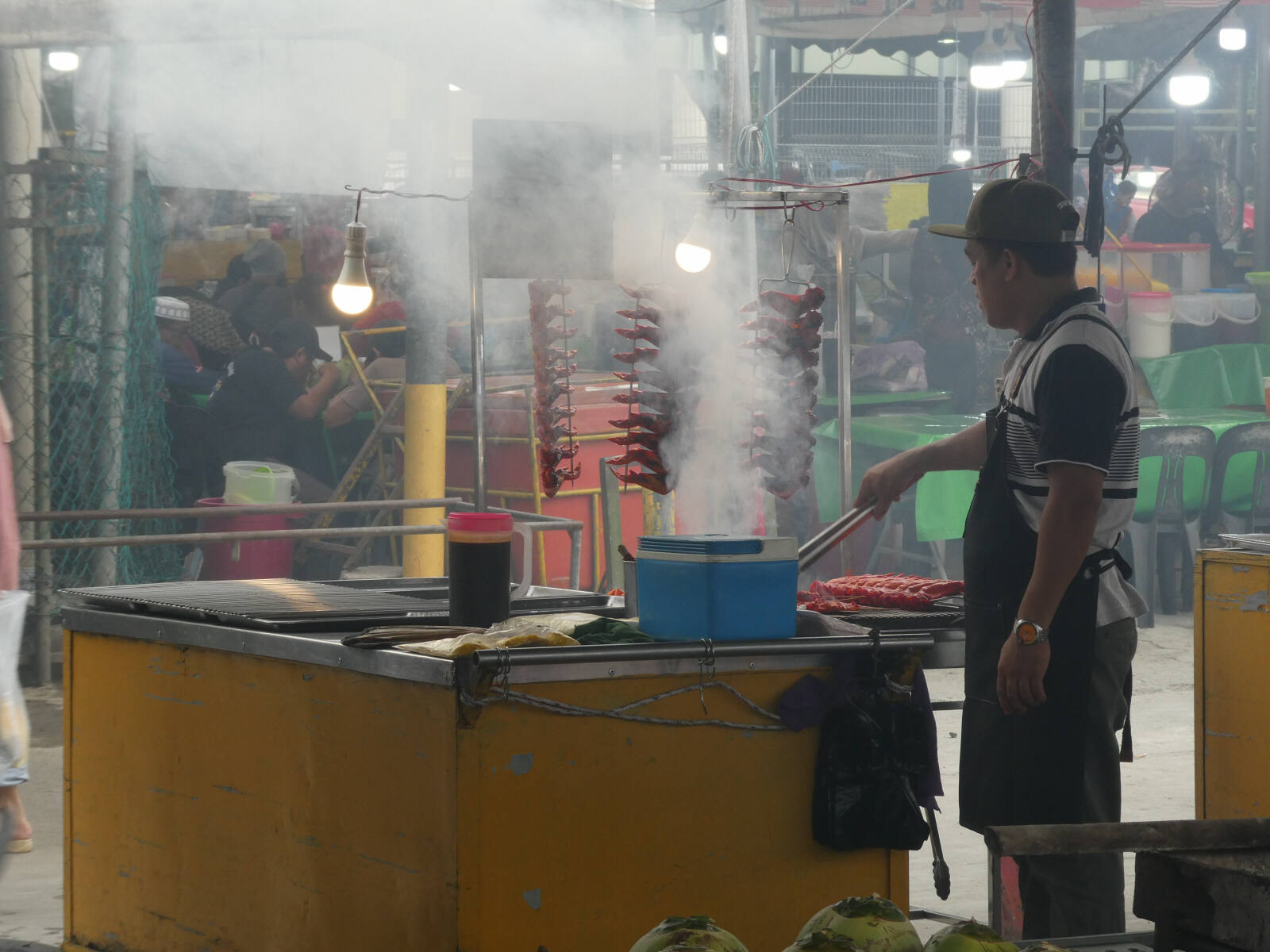 Barbecuing in the night food market at Kota Kinabalu, Saba, Borneo