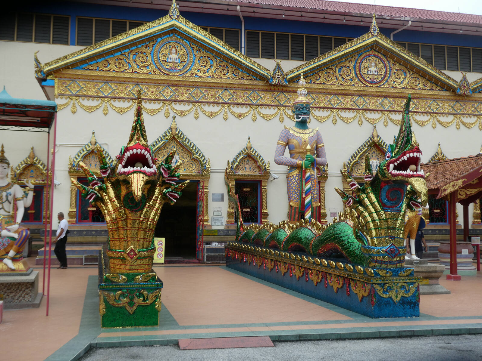 Guardians at the entrance to Wat Chaiya Mamalaram in Penang, Malaysia