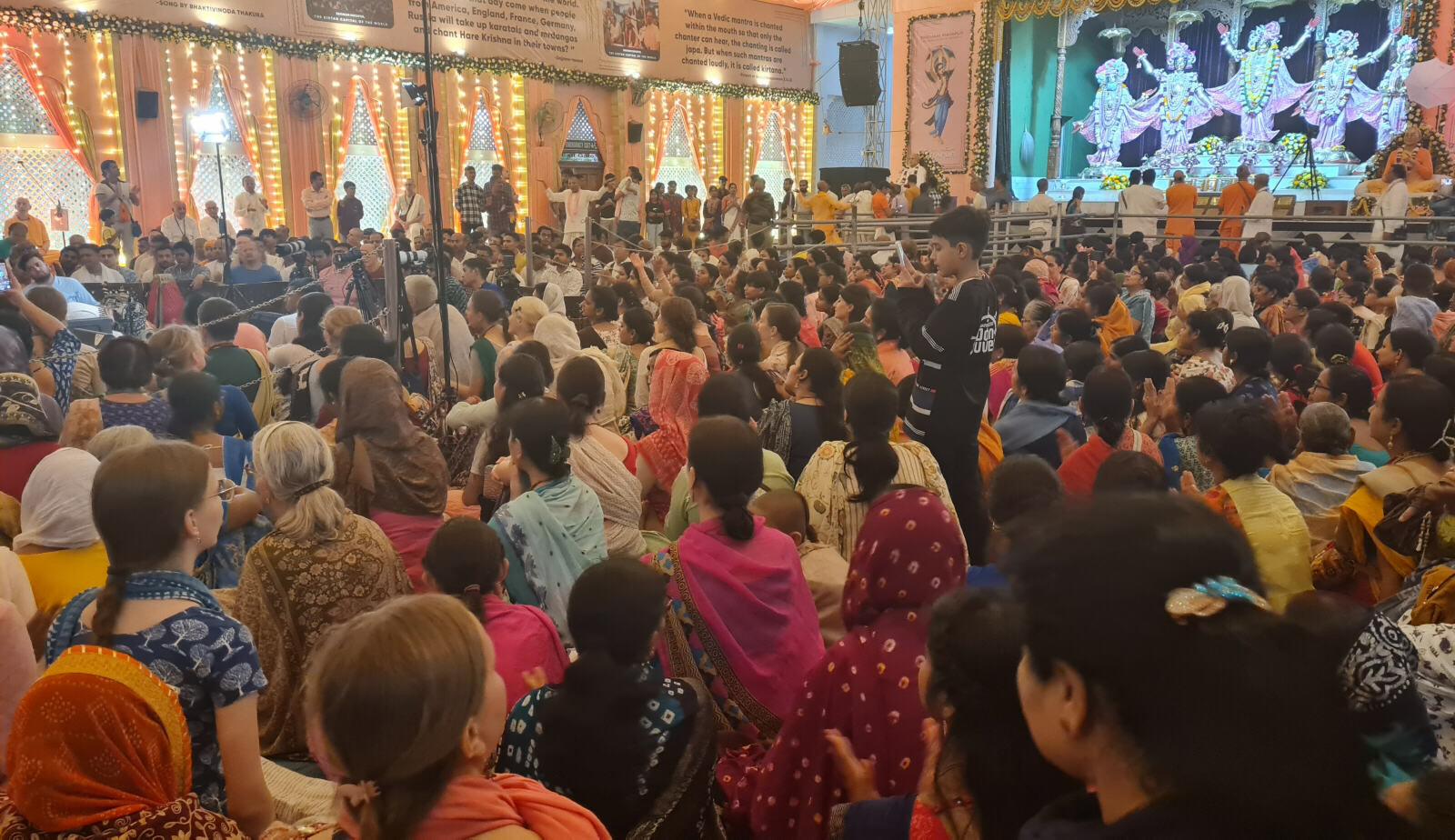 Devotees in the Krishna temple at Mayapore, West Bengal, India Devotees in the Krishna temple at Mayapore, West Bengal, India