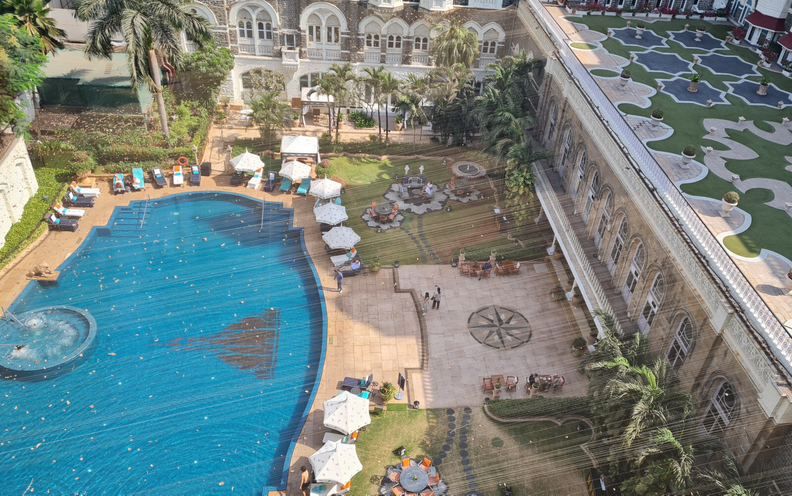 View of the swimming pool and gardens in the Taj Palace hotel, Mumbai View of the swimming pool and gardens in the Taj Palace hotel, Mumbai