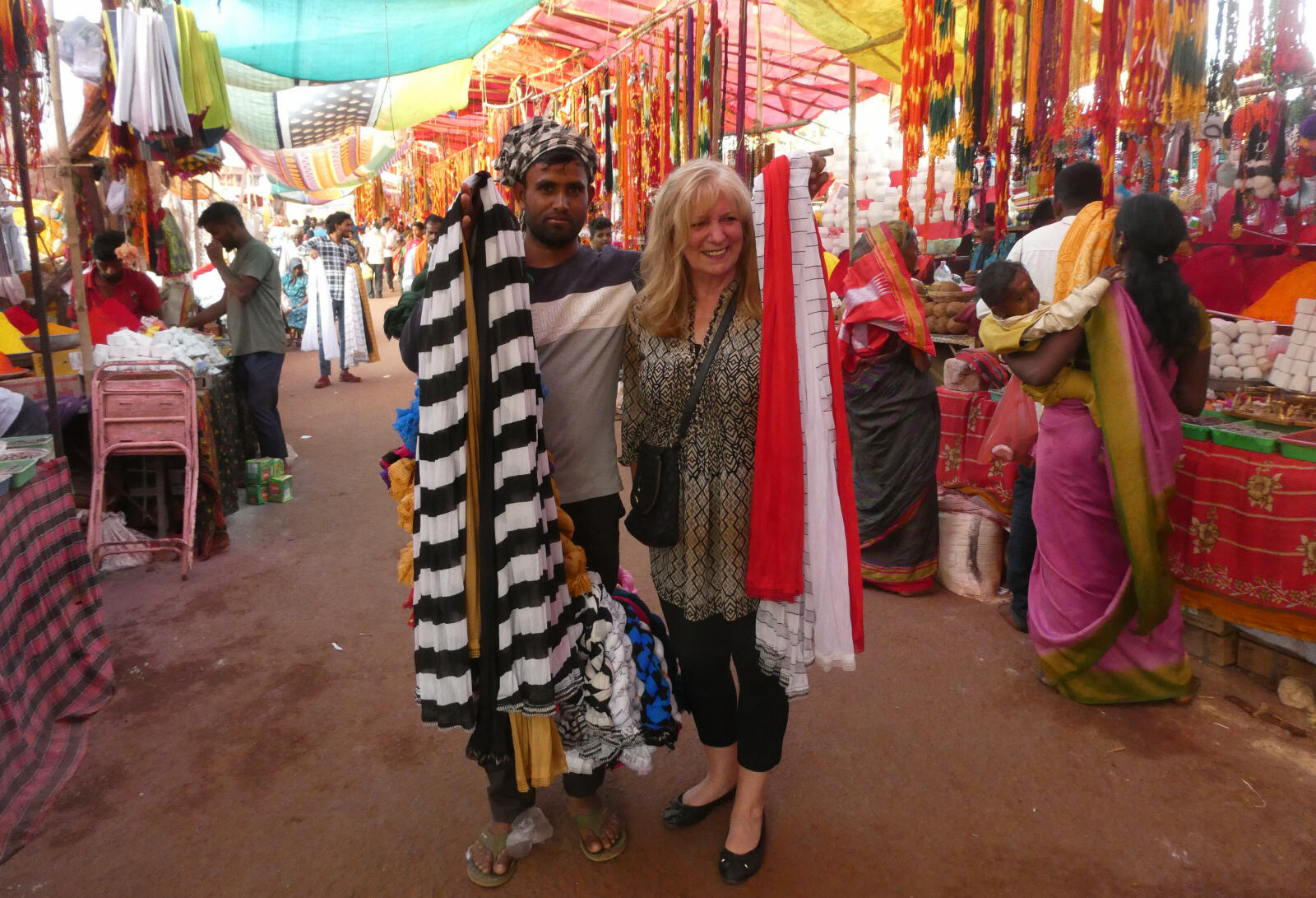 A fabric seller at the Banashankari festival in Badami, India A fabric seller at the Banashankari festival in Badami, India